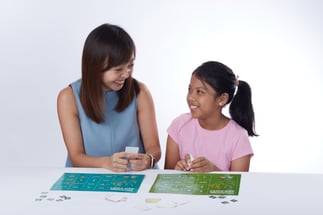Primary student and teacher at The Learning Lab doing maths together through interactive puzzles