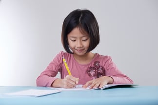 Student at The Learning Lab solving maths problems that uses real-world applications