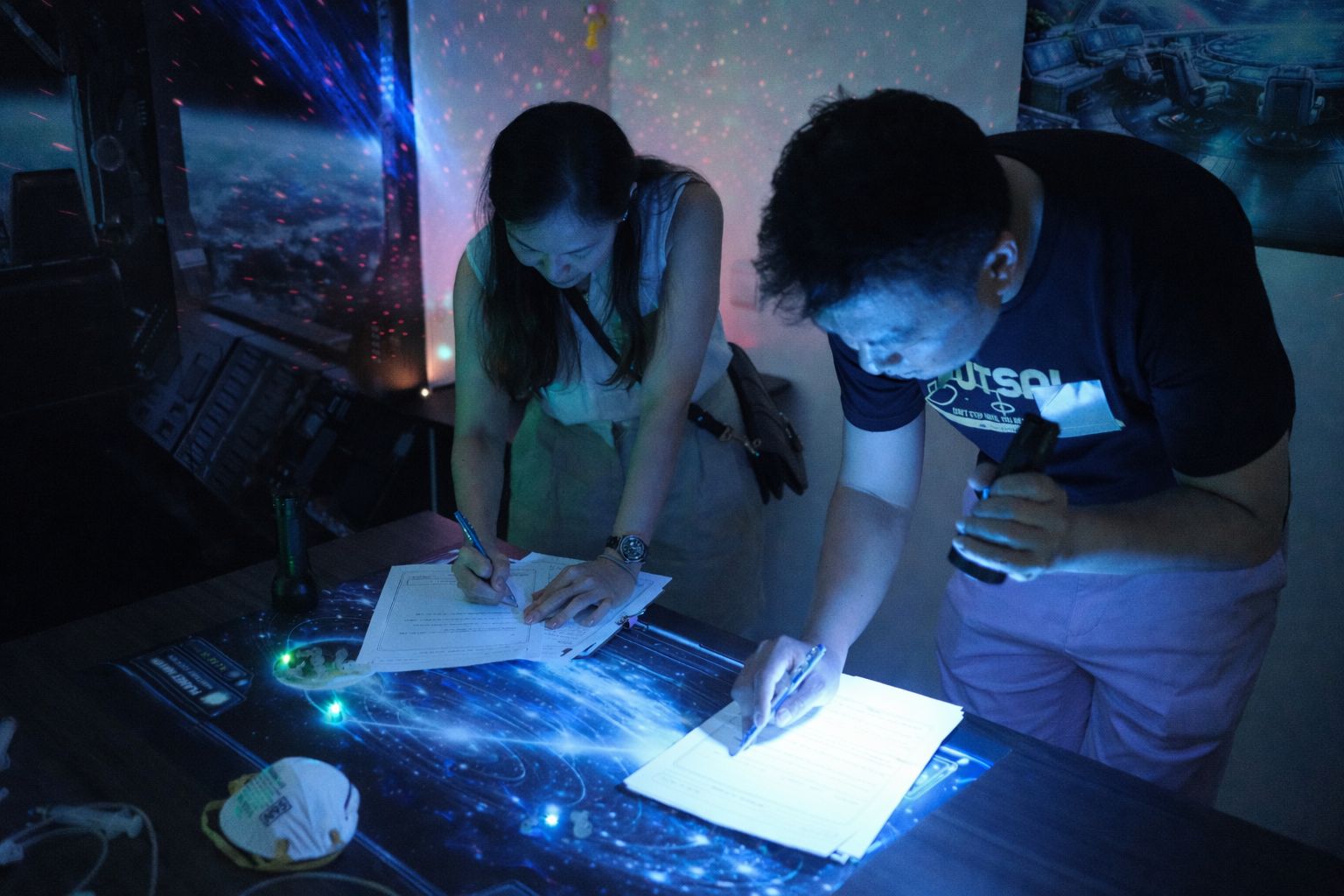 Parents working together to solve challenges during The Learning Lab's Space Odyssey event